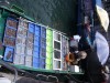 Fishermen selling seafood from their boat at the waterfront., Hong Kong, Sai Kung